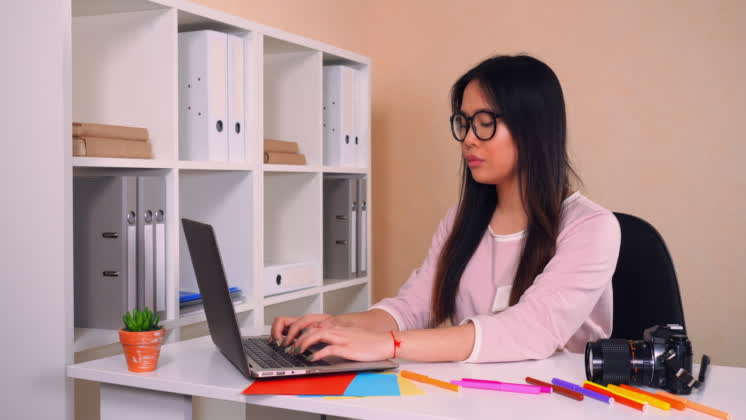 Photographer Using Pc At Work Beautiful Asian Brunette Working On Computer Sitting At The Workplace 2983