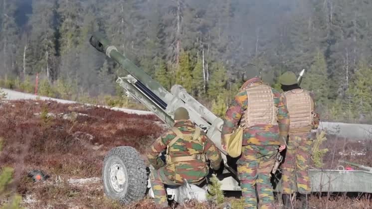 Soldiers load and fire M119 Howitzer Belgian and Norwegian artillery ...