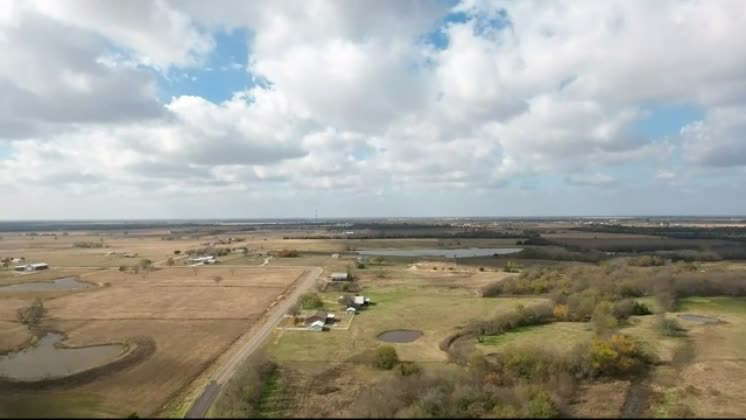 Video: Aerial of farmland, plains, and a ranch in Texas. An aerial of ...